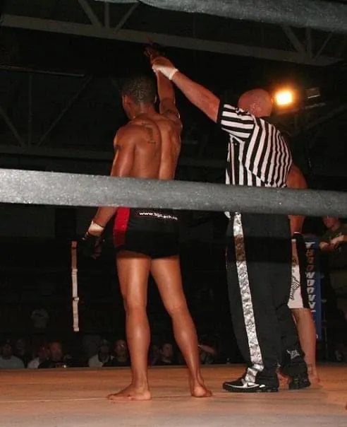 A fighter celebrating after an MMA bout